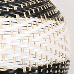 Dome pendant woven in black and natural rattan stripes