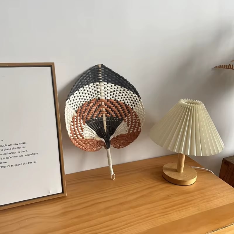 Leaf shaped woven hand fan with black, white and brown bands