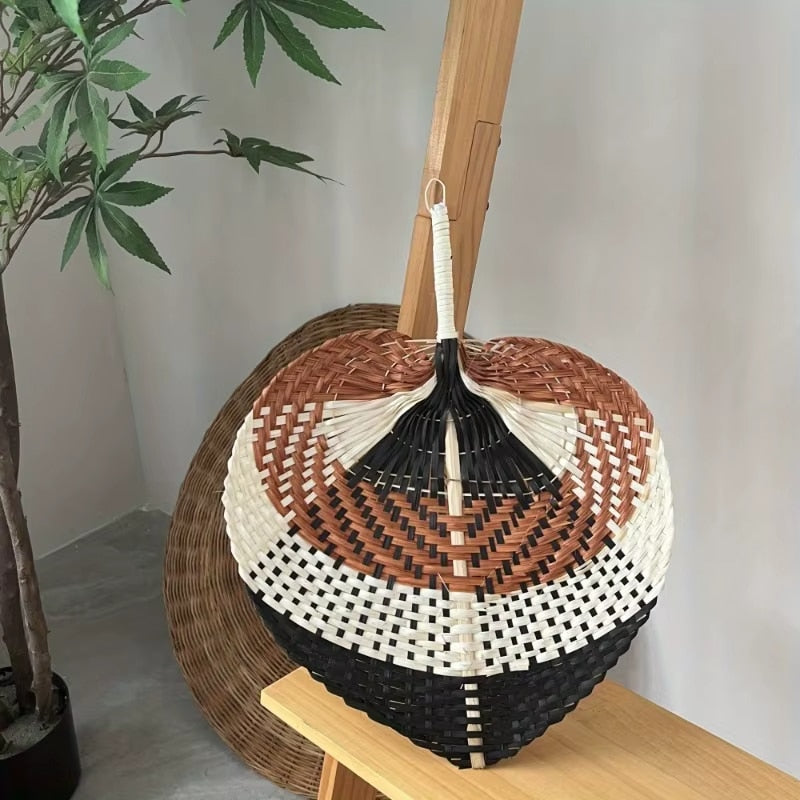 Leaf shaped woven hand fan with black, white and brown bands