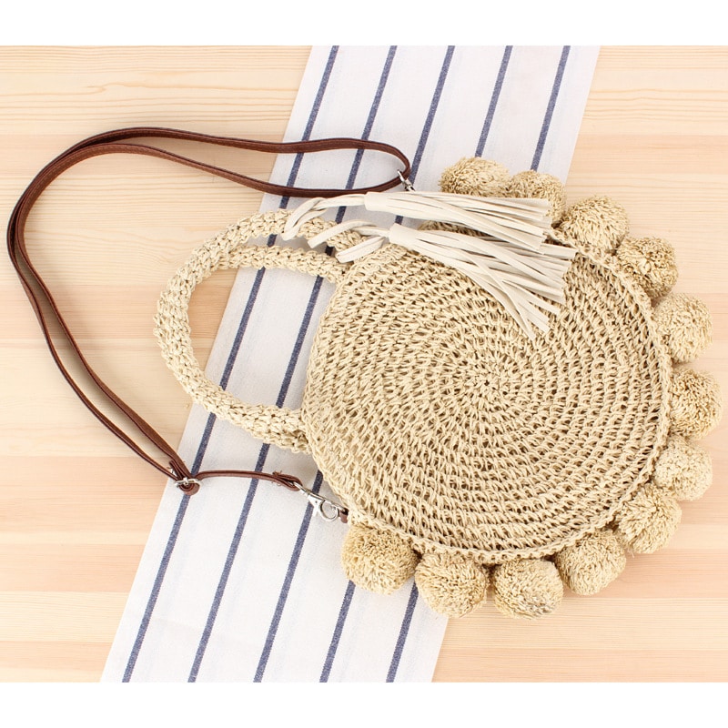 Vintage style beige woven straw beach bag with a tight weave