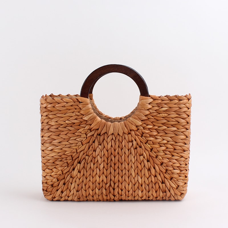 Vintage caramel brown hand woven rattan bag with round varnished wooden handles