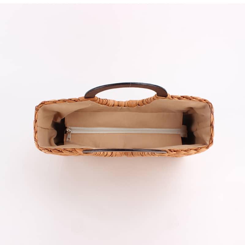 Vintage caramel brown hand woven rattan bag with round varnished wooden handles