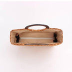 Vintage caramel brown hand woven rattan bag with round varnished wooden handles