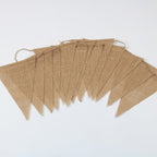 Vintage natural jute burlap pennant banner hung on a wall