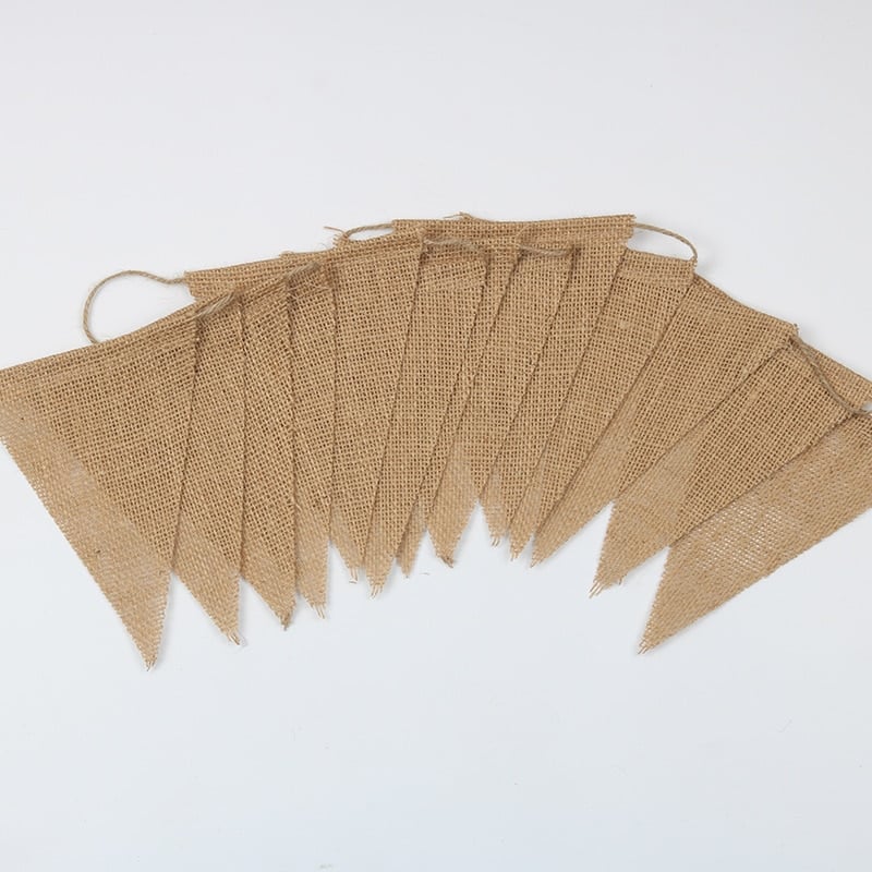 Vintage natural jute burlap pennant banner hung on a wall