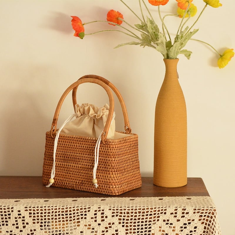 Honey rattan handbag with top handles and drawstring liner