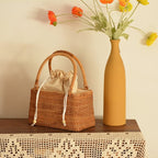 Honey rattan handbag with top handles and drawstring liner