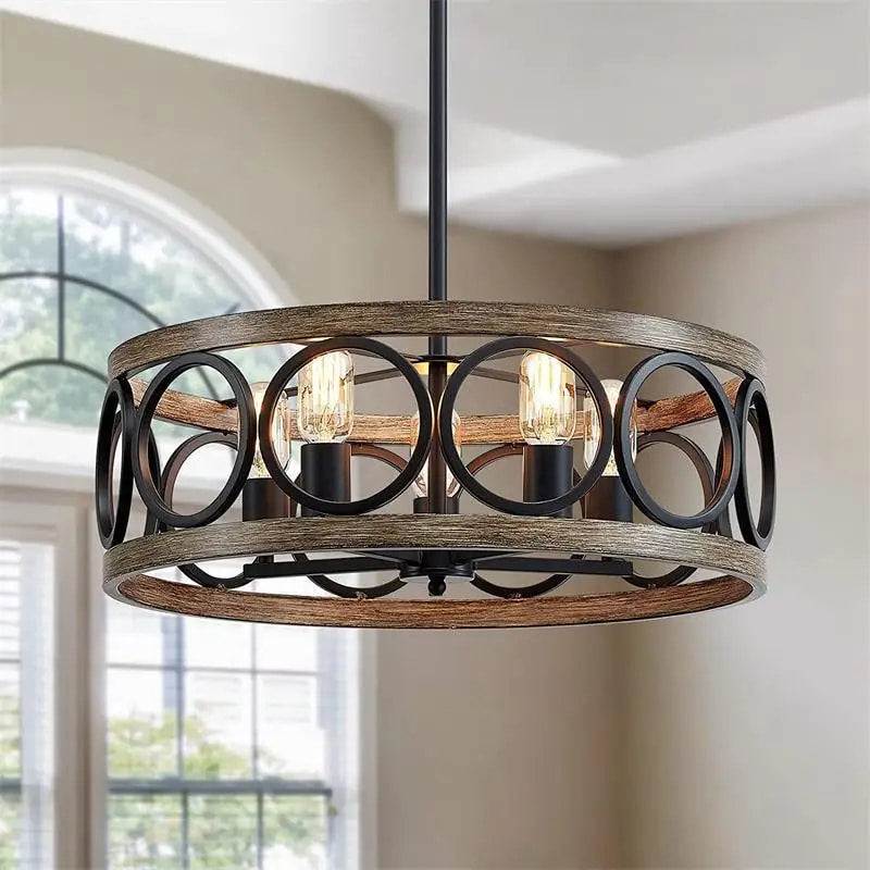 Vintage round chandelier with a raw wood ring hung on dark metal rods