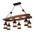 Vintage pendant light with a natural wood branch and six glass and metal lanterns