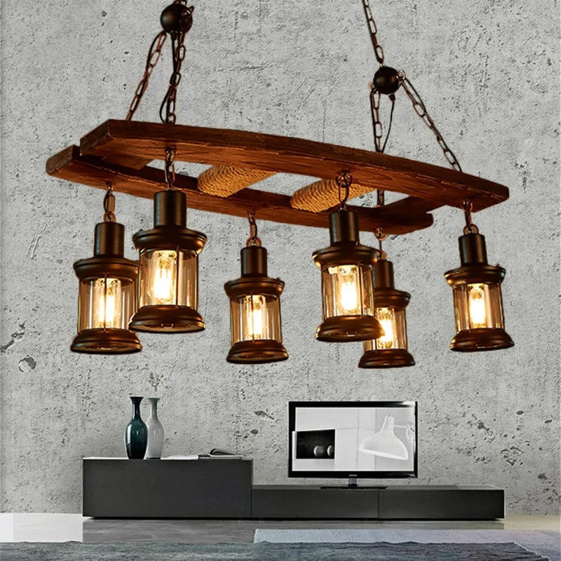 Vintage pendant light with a natural wood branch and six glass and metal lanterns