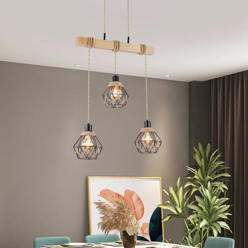 Vintage pendant light in natural wood hung by braided hemp rope