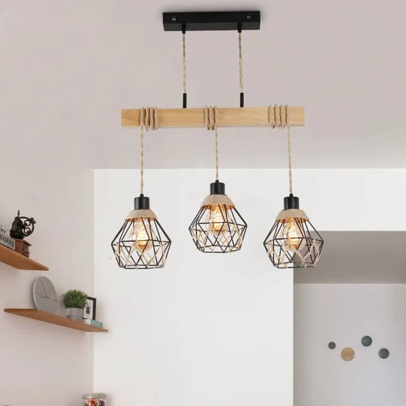Vintage pendant light in natural wood hung by braided hemp rope