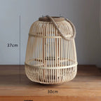 Square woven bamboo and rattan candle lantern with an arched handle