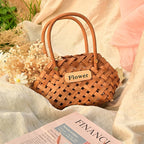 Three vintage woven flower baskets with handles and flowers