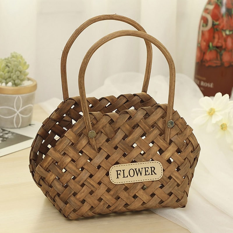Three vintage woven flower baskets with handles and flowers
