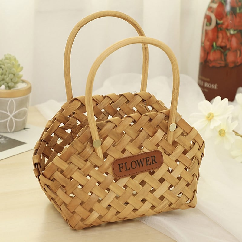 Three vintage woven flower baskets with handles and flowers