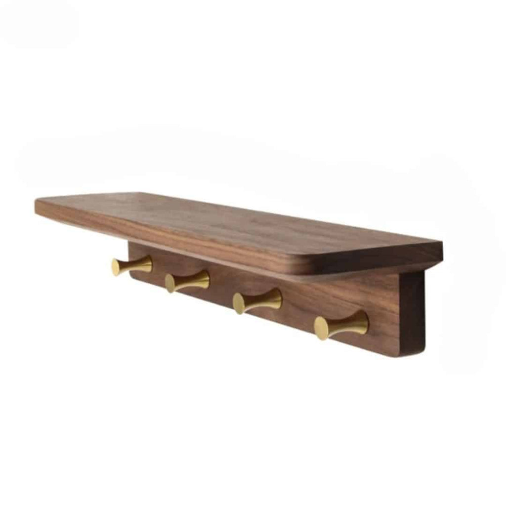 Walnut tone wood shelf with four brass key hooks