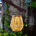 Hand woven beige rattan solar lantern for outdoor use