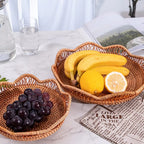 Shallow round brown rattan fruit basket with wavy rim