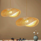 Round chandelier with softly wavy rings hand woven in natural rattan