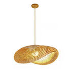 Round chandelier with softly wavy rings hand woven in natural rattan