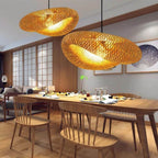 Round chandelier with softly wavy rings hand woven in natural rattan