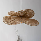 Wide wavy disc rattan pendant with radiating weave
