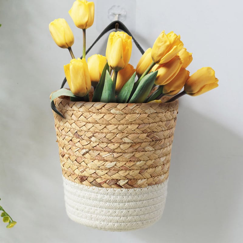 Seagrass wall basket with a white dipped base holding tulips