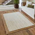 White jute rug with a natural braided border in a living room
