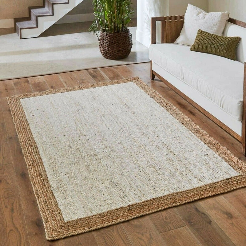 White jute rug with a natural braided border in a living room