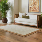 White jute rug with a natural braided border in a living room