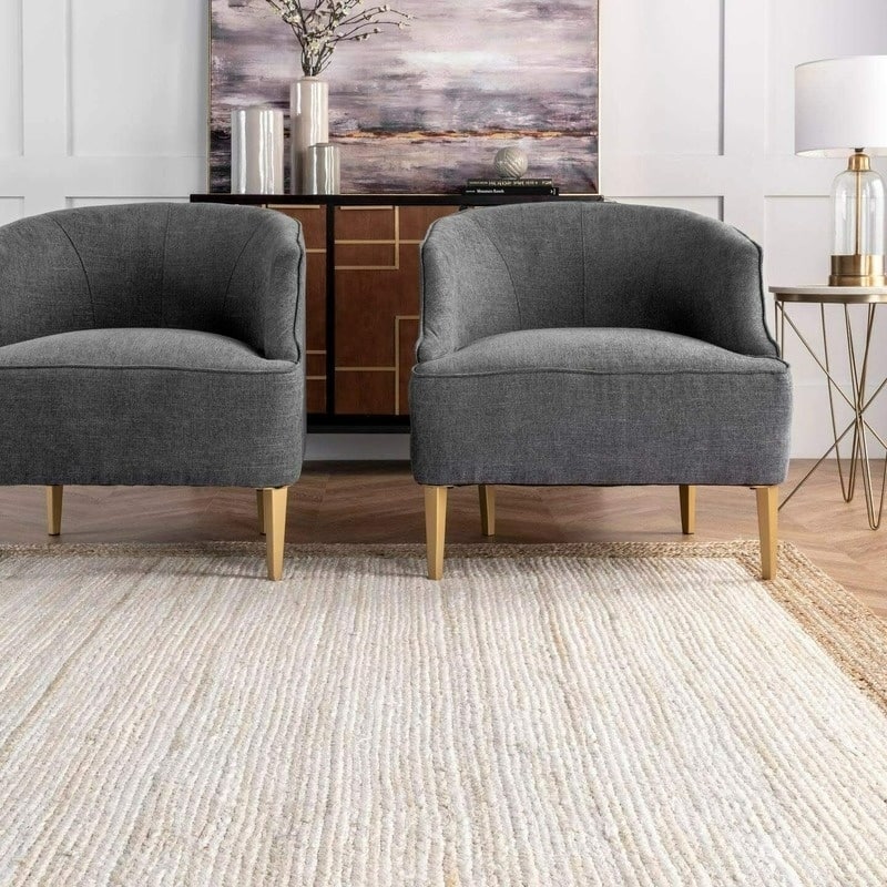 White jute rug with a natural braided border in a living room