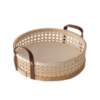 Round white rattan storage tray with stitched leather handles