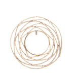 Round mirror framed by white rattan swirling loops