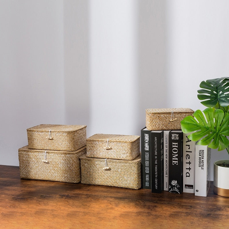 White hand woven rattan trunk box with a lid, offered in five sizes