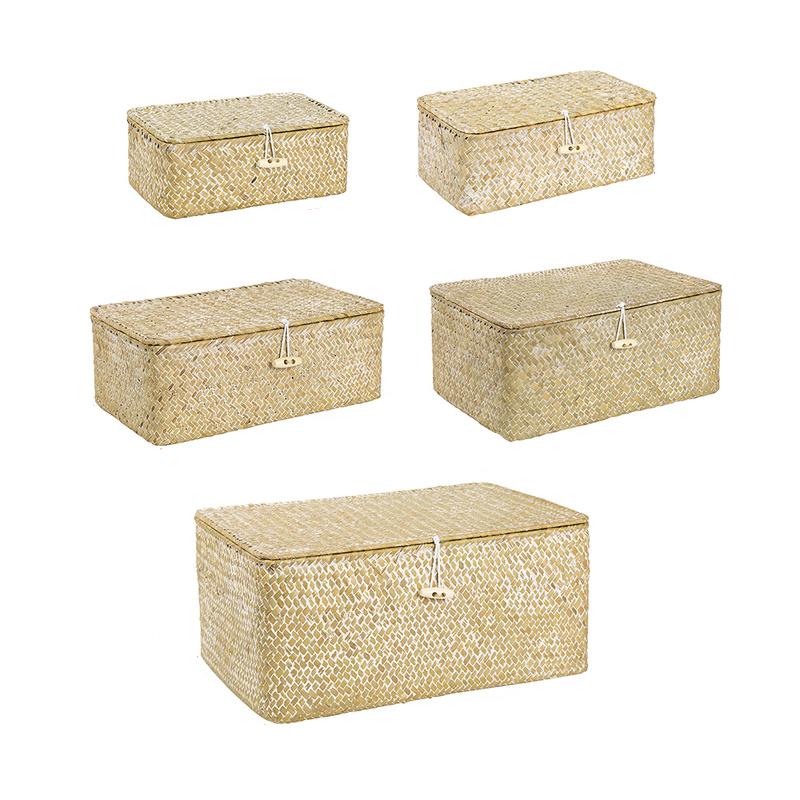 White hand woven rattan trunk box with a lid, offered in five sizes