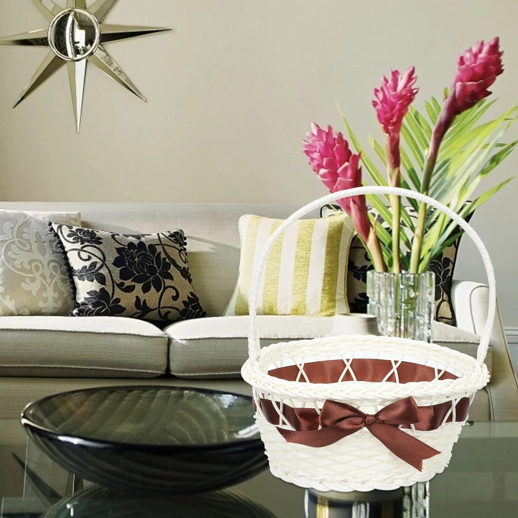 White wicker look basket with brown satin bow and tall handle