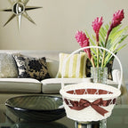 White wicker look basket with brown satin bow and tall handle