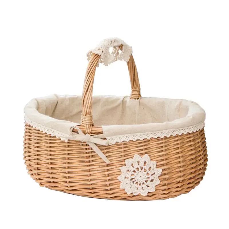 Oval wicker basket with lace trimmed liner and handle