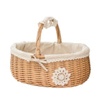 Oval wicker basket with lace trimmed liner and handle