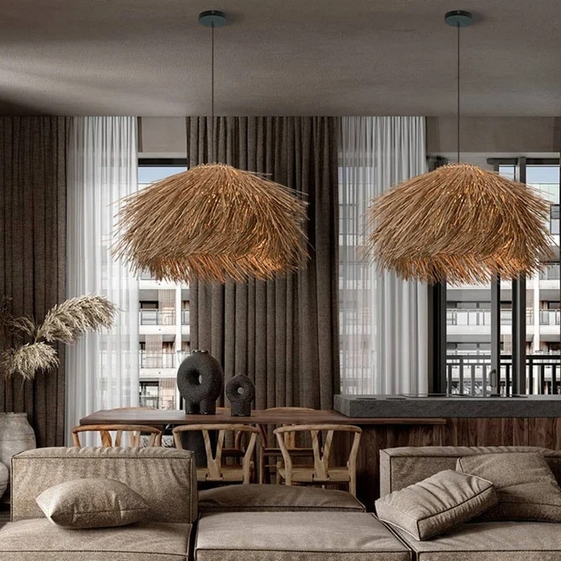 Three natural wicker fringe pendants over a dining table