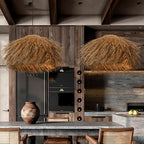 Three natural wicker fringe pendants over a dining table