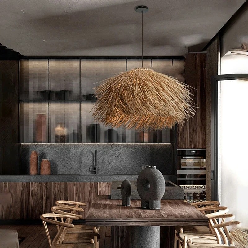 Three natural wicker fringe pendants over a dining table
