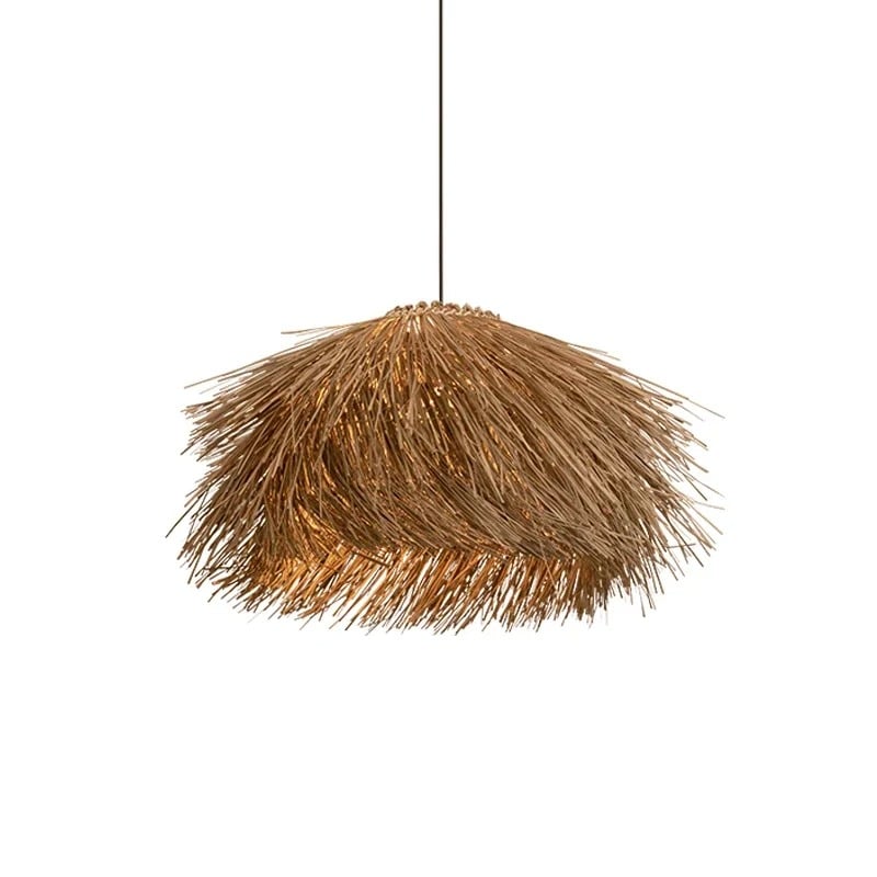 Three natural wicker fringe pendants over a dining table