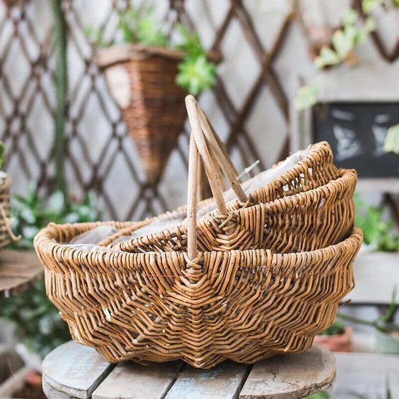 Oval wicker gathering baskets with tall handles