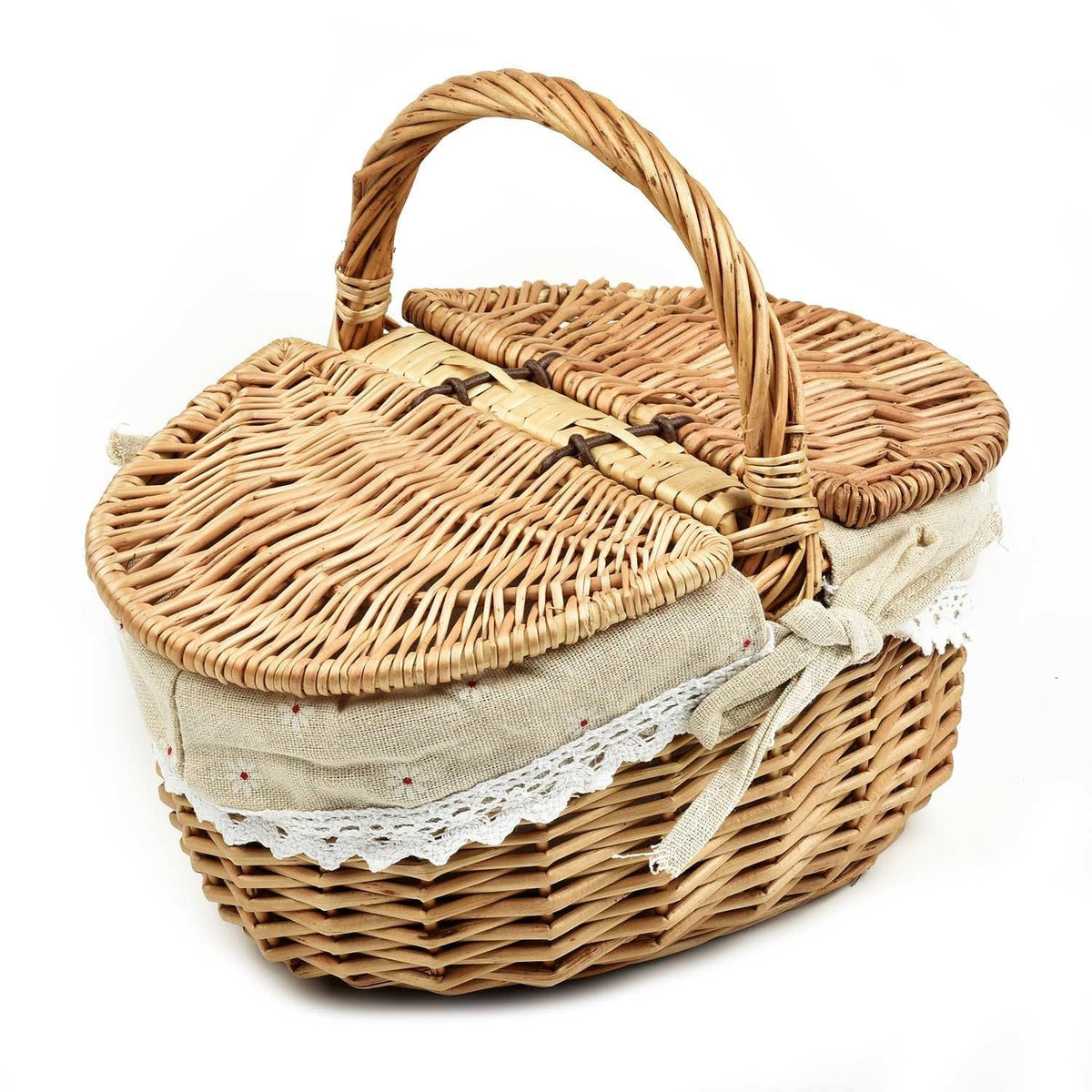 Oval wicker basket with flip lid and lace liner on a garden bench