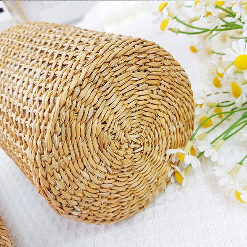 Wicker wrapped glass vase holding fresh flowers