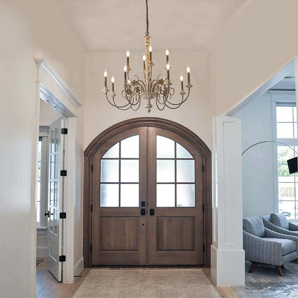 Large chandelier with a wood structure and wrought iron arms with candle style sockets