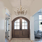Large chandelier with a wood structure and wrought iron arms with candle style sockets