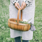 Oval woven wood chip basket with bentwood handle